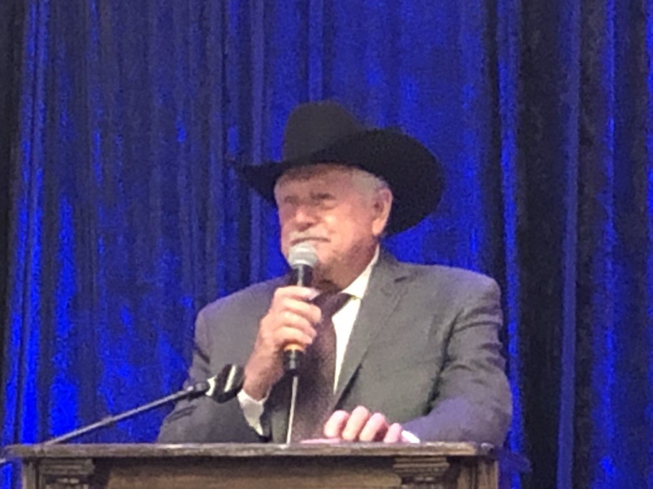 Auctioneer Glenn Beckendorff encourages guests to purchase one of 10 items put up for sale in a live auction at the 18th annual Katy Christian Ministries Transforming Lives Gala. The gala was held at Safari Texas Ranch in Richmond.